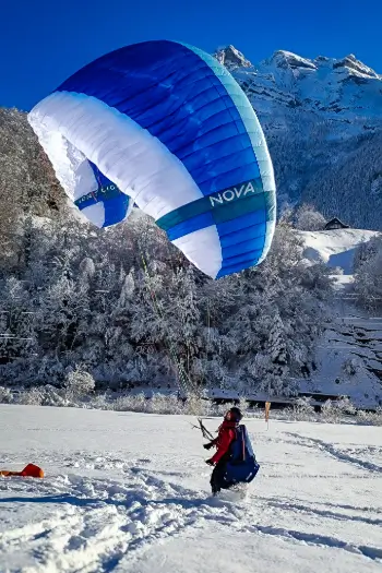 Pilot with Nova paraglider in Central Switzerland - Discover high-quality paragliding equipment from Nova, WoodyValley, Highadventure and more at attractive prices with us.