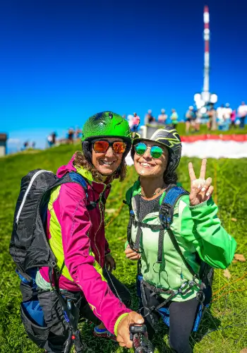 andempilot and passenger are ready for take-off on the Rigi, the "Queen of the Mountains", for a tandem flight with touch and go paragliding.