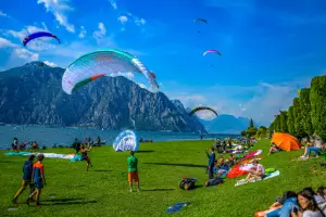 Paraglider lands after a successful training flight during safety training on Lake Garda.