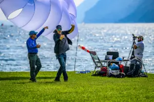 Flight instructor and participants of the safety training discuss a flight maneuver with visualization during a safety training at touch and go paragliding.