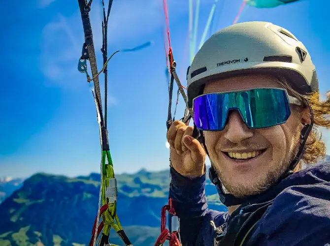 Florian Lerf supports touch and go paragliding with safety training on the rescue boat.