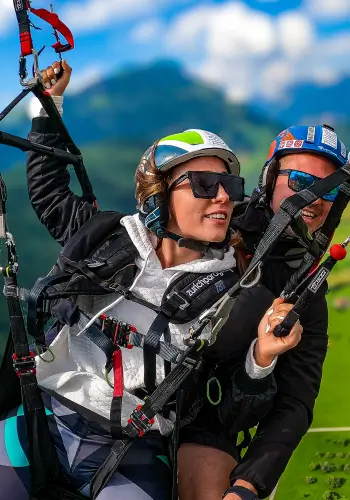 Student pilots the paraglider under the guidance of the tandem pilot - the perfect introduction to paragliding