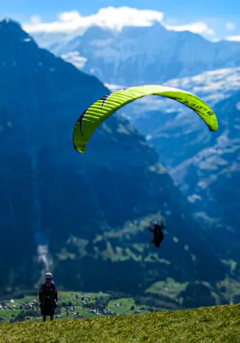 Students in the air after take-off during paragliding training at touch and go Paragliding.