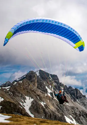 A student takes off with a Nova paraglider at the launch site, ready for his next flying adventure in central Switzerland.